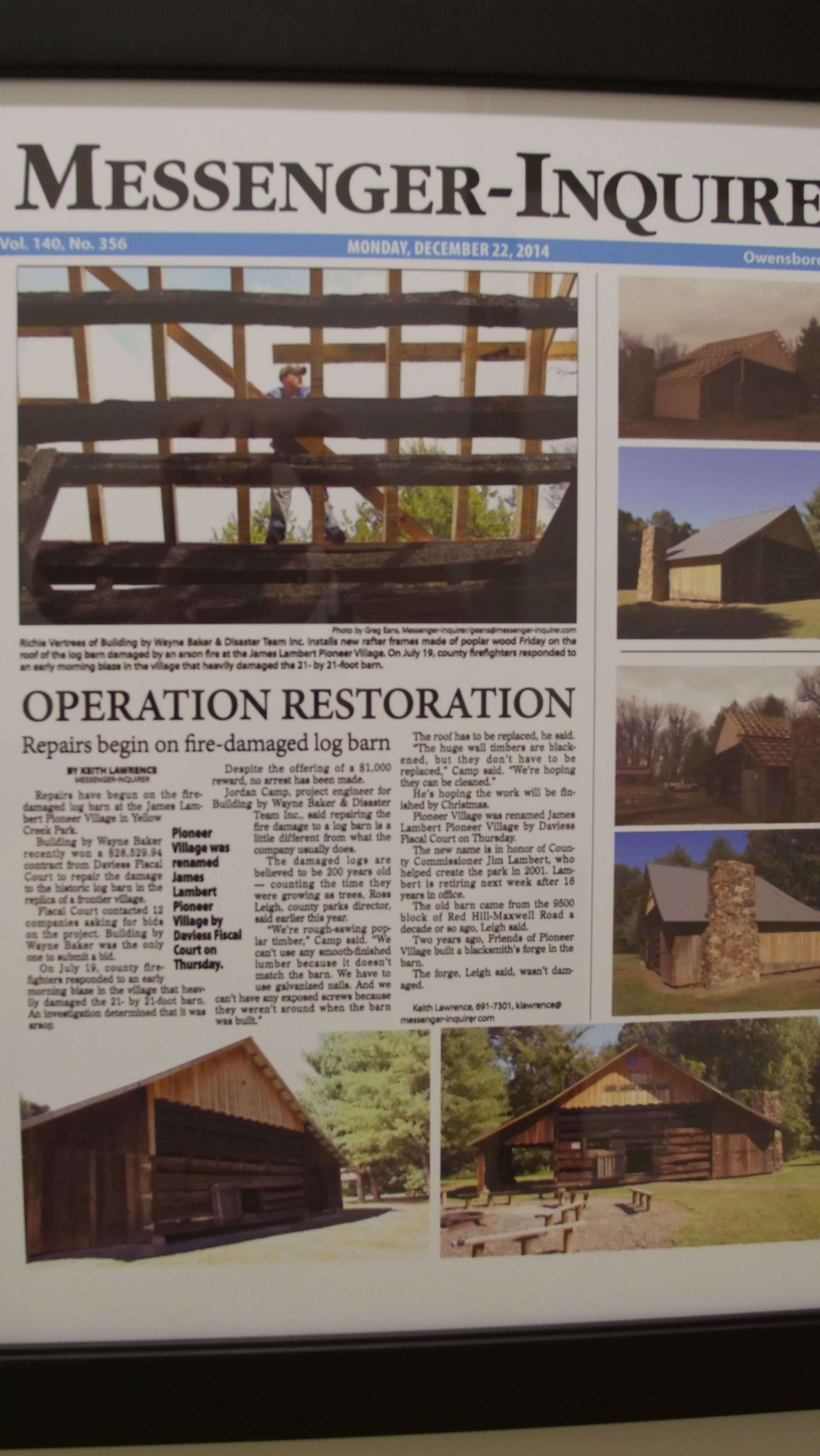Newspaper showing building damaged by fire being restored